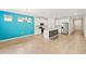 Open kitchen with a bright accent wall and stainless steel appliances at 260 Soliera St, Nokomis, FL 34275