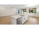 Bright kitchen with a center island, stainless steel appliances, and an open layout at 260 Soliera St, Nokomis, FL 34275