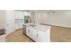 Modern kitchen featuring stainless steel appliances, a large island, and stylish countertops at 260 Soliera St, Nokomis, FL 34275