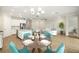 Open-concept living space with modern kitchen, dining area, and comfortable seating at 260 Soliera St, Nokomis, FL 34275