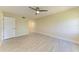 Bright bedroom with updated floors and a ceiling fan is move-in ready at 2718 Orchid Oaks Dr # C-202, Sarasota, FL 34239