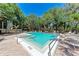 Large community pool with plenty of seating for residents at 2718 Orchid Oaks Dr # C-202, Sarasota, FL 34239
