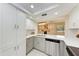 Beautiful kitchen featuring white cabinets, stainless steel appliances, and a bright open layout at 2718 Orchid Oaks Dr # C-202, Sarasota, FL 34239