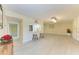 Bright living room featuring tile floors, breakfast bar and an open floor plan at 2718 Orchid Oaks Dr # C-202, Sarasota, FL 34239