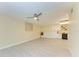 Bright living room with tile floors, recessed lights, and stylish bar area at 2718 Orchid Oaks Dr # C-202, Sarasota, FL 34239