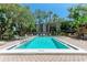 Community pool with clean, clear water and well-kept surroundings at 2718 Orchid Oaks Dr # C-202, Sarasota, FL 34239