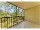 Screened-in porch with views of lush landscaping at 2718 Orchid Oaks Dr # C-202, Sarasota, FL 34239