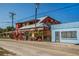 Commercial building featuring unique architectural elements and outdoor dining area at 29704 Niagara Court, Englewood, FL 34223