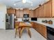 Bright kitchen featuring stainless steel appliances, ample counter space, and a functional center island at 29704 Niagara Court, Englewood, FL 34223