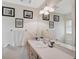 Updated bathroom featuring white countertop, framed mirror, and neutral paint and flooring at 3199 Elkrem Ave, North Port, FL 34286