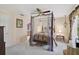 Bedroom featuring a four poster bed, ceiling fan, and chandelier at 3199 Elkrem Ave, North Port, FL 34286
