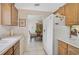 Eat in kitchen features dining room, stainless steel refrigerator, and light-wood cabinets at 3199 Elkrem Ave, North Port, FL 34286
