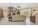 Comfortable living room with a stone fireplace, tiled floors, and large window with a window seat at 3199 Elkrem Ave, North Port, FL 34286