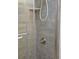 Gray tile shower with glass door at 333 The Esplanade N # 102, Venice, FL 34285