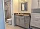 Bathroom featuring updated vanity and granite counter, and a glass enclosed shower at 333 The Esplanade N # 102, Venice, FL 34285