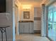 Bathroom featuring modern vanity and counter, sliding glass door, and modern lighting at 333 The Esplanade N # 102, Venice, FL 34285
