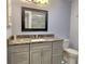 Updated bathroom featuring a granite vanity and a large mirror at 333 The Esplanade N # 102, Venice, FL 34285