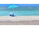 Secluded beach with beach chairs and umbrella for relaxing by the ocean at 333 The Esplanade N # 102, Venice, FL 34285