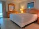 Spacious bedroom with tile flooring, wooden furniture, and a light airy atmosphere at 333 The Esplanade N # 102, Venice, FL 34285