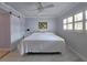 Bedroom features light purple walls and a sliding barn door at 333 The Esplanade N # 102, Venice, FL 34285
