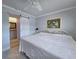 Bedroom with view of bathroom shows barn door, paint, and tile at 333 The Esplanade N # 102, Venice, FL 34285
