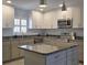 Well-appointed kitchen featuring granite countertops and stainless steel appliances at 333 The Esplanade N # 102, Venice, FL 34285
