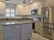 Modern kitchen with granite countertops and stainless steel appliances at 333 The Esplanade N # 102, Venice, FL 34285