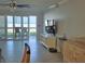 A bright living room with a sliding glass door and beach views at 333 The Esplanade N # 102, Venice, FL 34285
