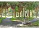 Beautiful park featuring walking paths, benches, lush greenery, and mature trees, perfect for outdoor enjoyment at 333 The Esplanade N # 102, Venice, FL 34285
