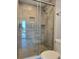 Modern tile shower with a glass door and an ocean view at 333 The Esplanade N # 102, Venice, FL 34285
