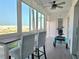 Cozy sunroom with breakfast bar and beach views, perfect for relaxing and enjoying the scenery at 333 The Esplanade N # 102, Venice, FL 34285