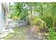 Backyard featuring lush greenery and a white lattice fence at 3340 Webber St, Sarasota, FL 34239