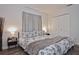 Cozy bedroom featuring a bed with stylish black and white linens, complemented by sleek, modern bedside tables at 3340 Webber St, Sarasota, FL 34239