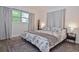 Comfortable bedroom boasts natural light, neutral tones and cozy furnishings at 3340 Webber St, Sarasota, FL 34239