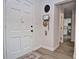 Inviting entryway with a white door and stylish décor, creating a warm and welcoming ambiance at 3340 Webber St, Sarasota, FL 34239