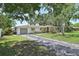 Charming single-story home with a well-maintained lawn and a driveway that provides ample parking space at 3340 Webber St, Sarasota, FL 34239