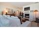 Bright living room showcases fireplace, TV, plush seating, wood floors, and elegant decor at 3340 Webber St, Sarasota, FL 34239