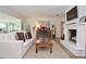 Bright living room showcases fireplace, plush seating, wood floors, and elegant decor at 3340 Webber St, Sarasota, FL 34239