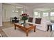 Open living room showcases dining area and a cozy seating arrangement with natural light at 3340 Webber St, Sarasota, FL 34239