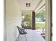 Covered porch with seating area, providing a relaxing outdoor space to enjoy the neighborhood views at 3340 Webber St, Sarasota, FL 34239
