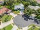 Aerial view of a charming home surrounded by lush greenery and a cul-de-sac at 337 Meadow Beauty Ct, Venice, FL 34293