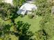 Aerial view showcasing the lush backyard with mature trees at 337 Meadow Beauty Ct, Venice, FL 34293