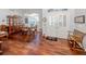 Elegant dining room with hardwood floors, a china cabinet, and a view of the entrance at 337 Meadow Beauty Ct, Venice, FL 34293
