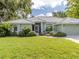 Inviting home exterior with lush landscaping and a well-manicured lawn at 337 Meadow Beauty Ct, Venice, FL 34293