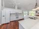 Bright and airy kitchen features white cabinets, stone countertops, and stainless steel appliances at 337 Meadow Beauty Ct, Venice, FL 34293