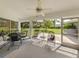 Covered Lanai with outdoor seating, ceiling fan, and views of backyard at 337 Meadow Beauty Ct, Venice, FL 34293