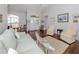 Inviting living room features hardwood floors, high ceilings, and an abundance of natural light at 337 Meadow Beauty Ct, Venice, FL 34293