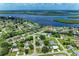Aerial view of a waterfront community with canals, lush landscaping, and homes with boat docks at 3376 Peace River Dr, Punta Gorda, FL 33983