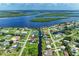 Waterfront homes lining interconnected canals offer picturesque views and convenient access to boating and water activities at 3376 Peace River Dr, Punta Gorda, FL 33983