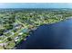 A neighborhood of waterfront homes with boat docks is located along a wide canal leading to open water at 3376 Peace River Dr, Punta Gorda, FL 33983